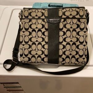 Black and grey coach purse.